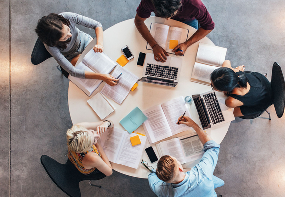 image of students around a table